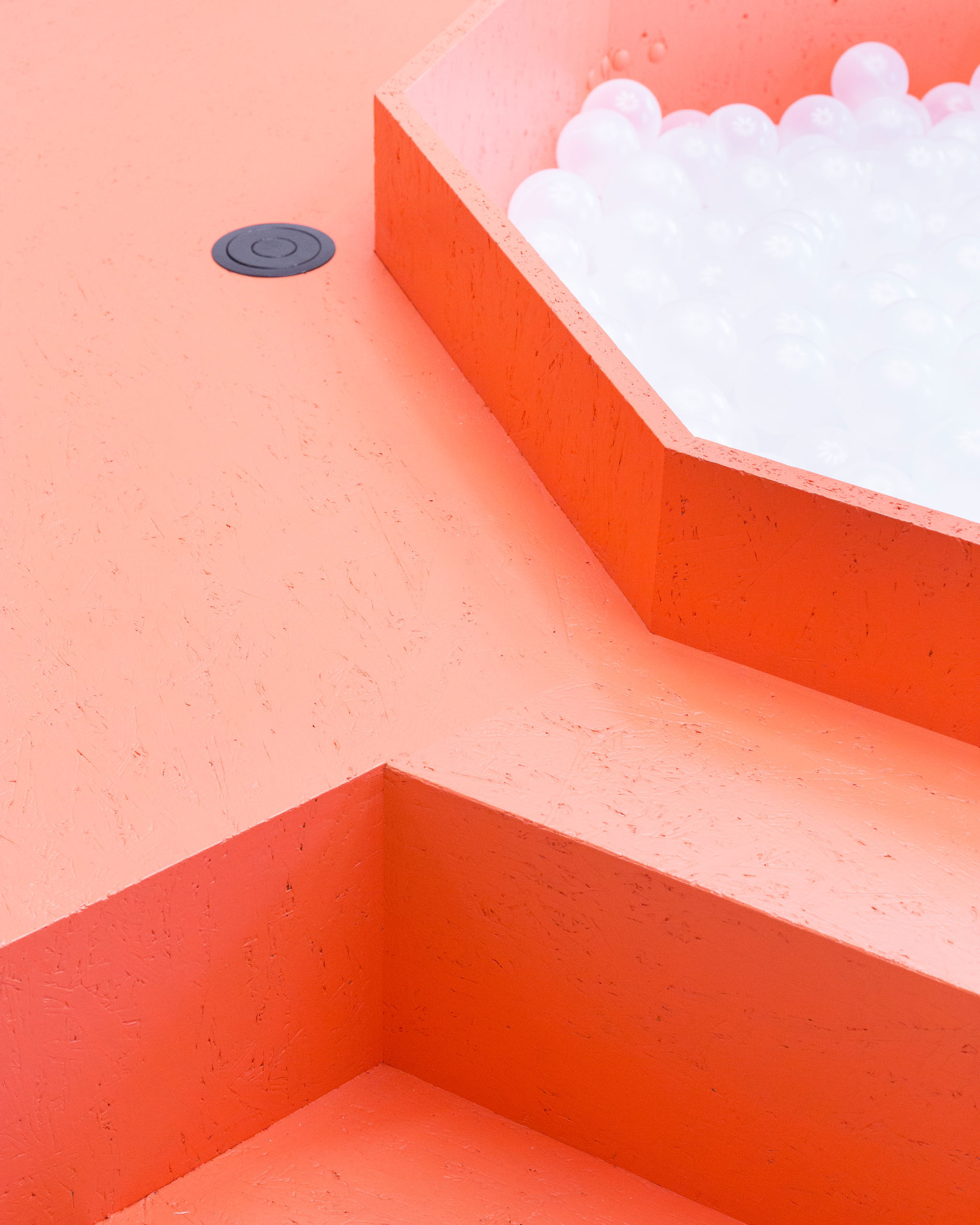 A detail of a bright orange piece of furniture in the Neue Denkerei.