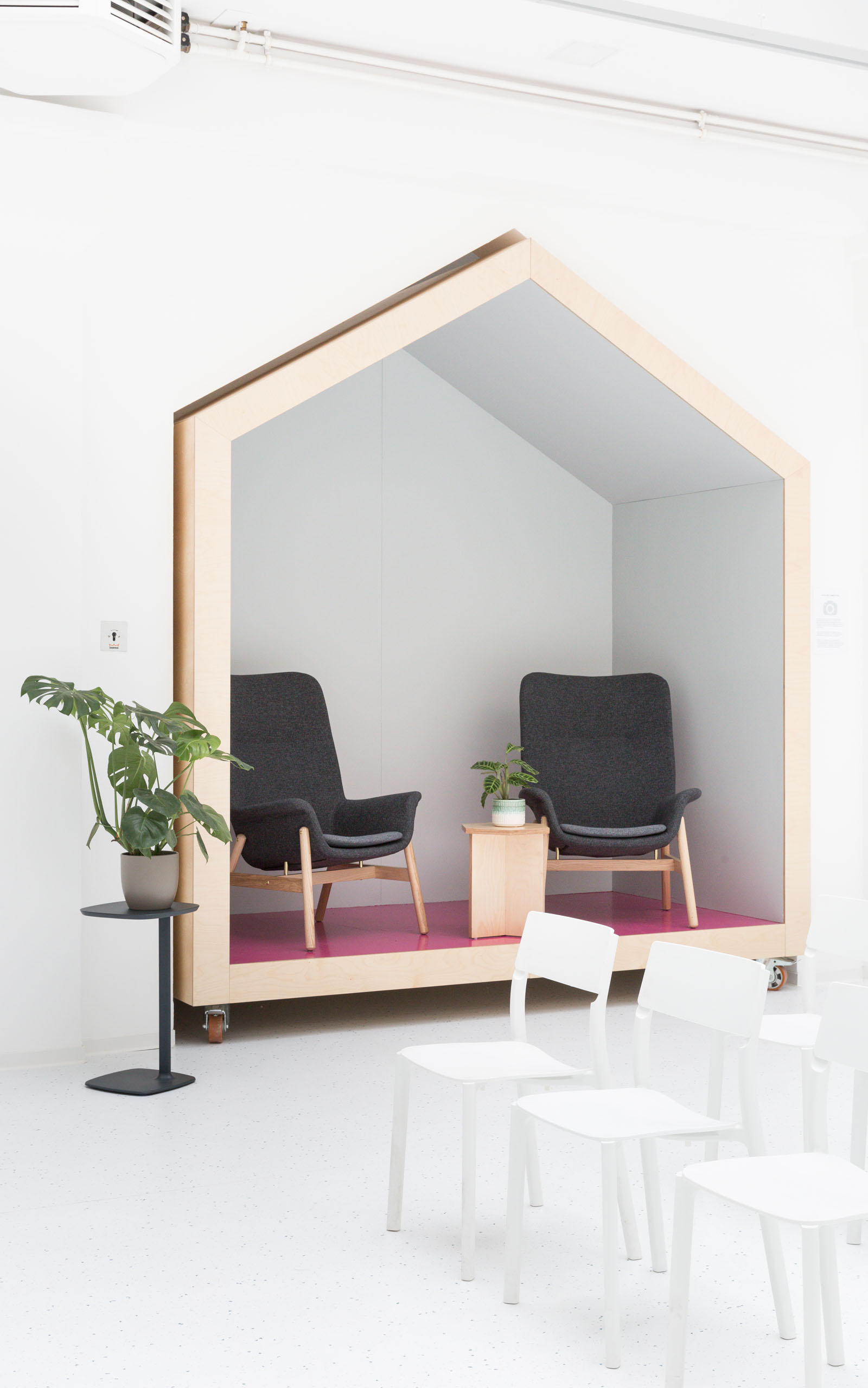 A type of microarchitecture in the iconic shape of a house standing in the Startraum coworking space.